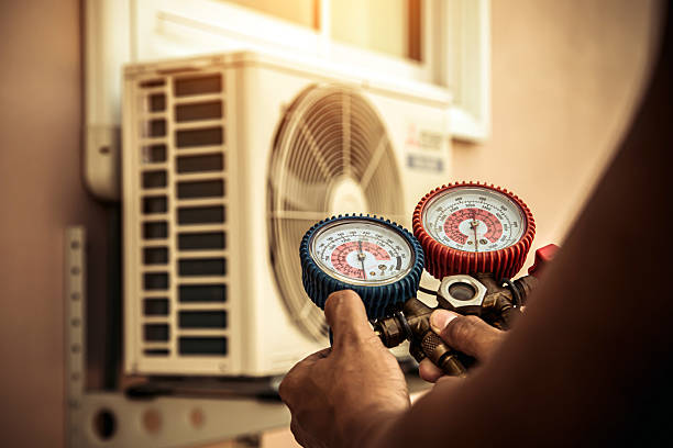 Professional Air Conditioning Service technician working in Pickwick Dam, TN
